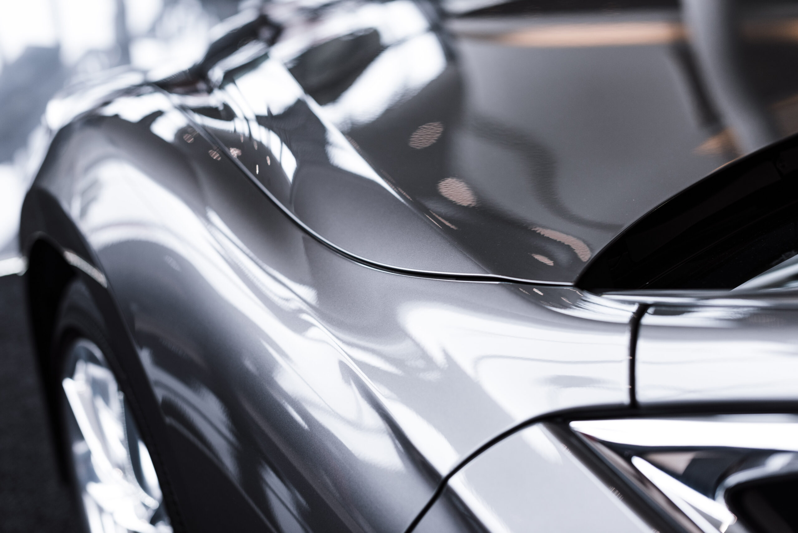 Close-up of silver luxury car bodywork
