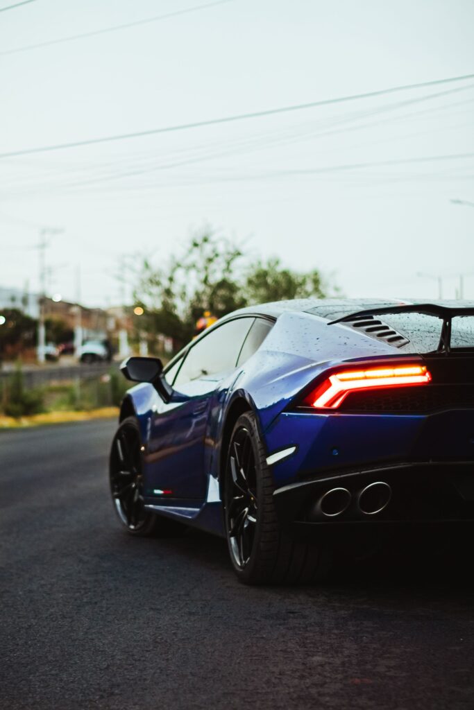 Blue Lamborghini Huracán rear and taillight at dusk