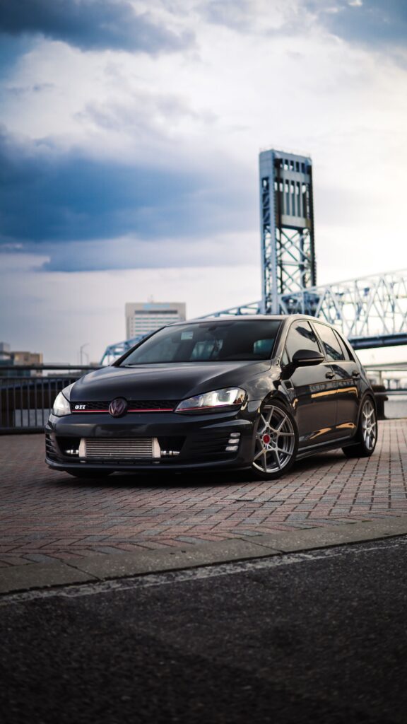 Black Volkswagen Golf GTI at dusk