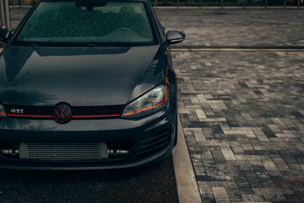 Volkswagen Golf GTI front on a wet street