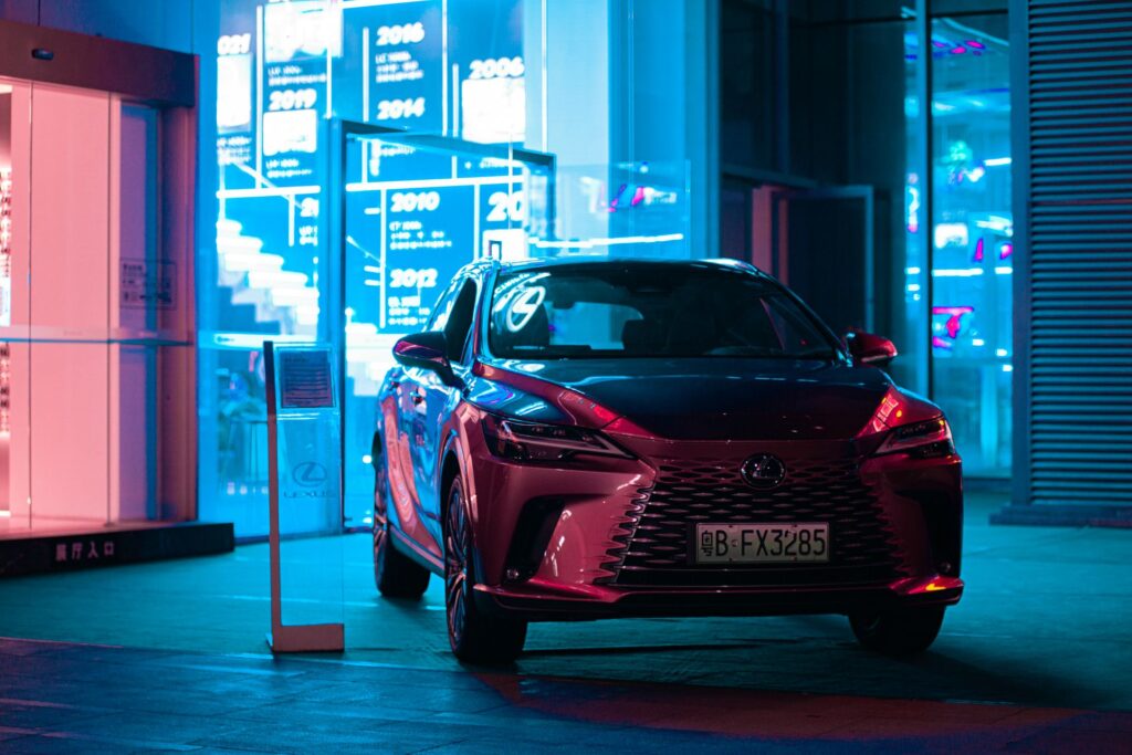 Lexus in red under neon lighting at night