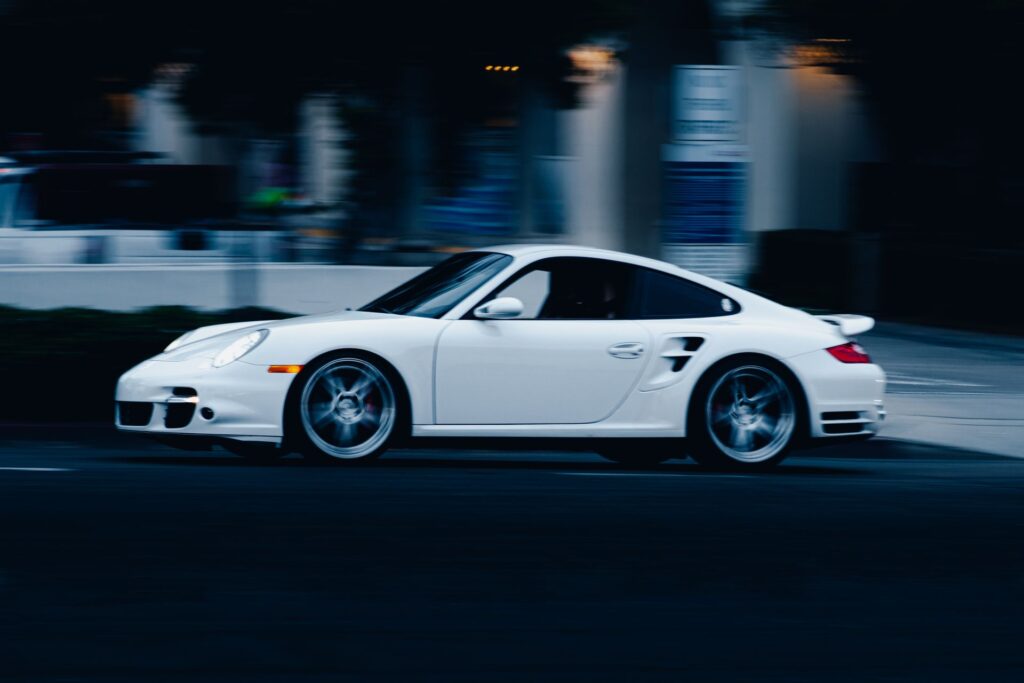 Porsche 911 Turbo in white, captured in motion