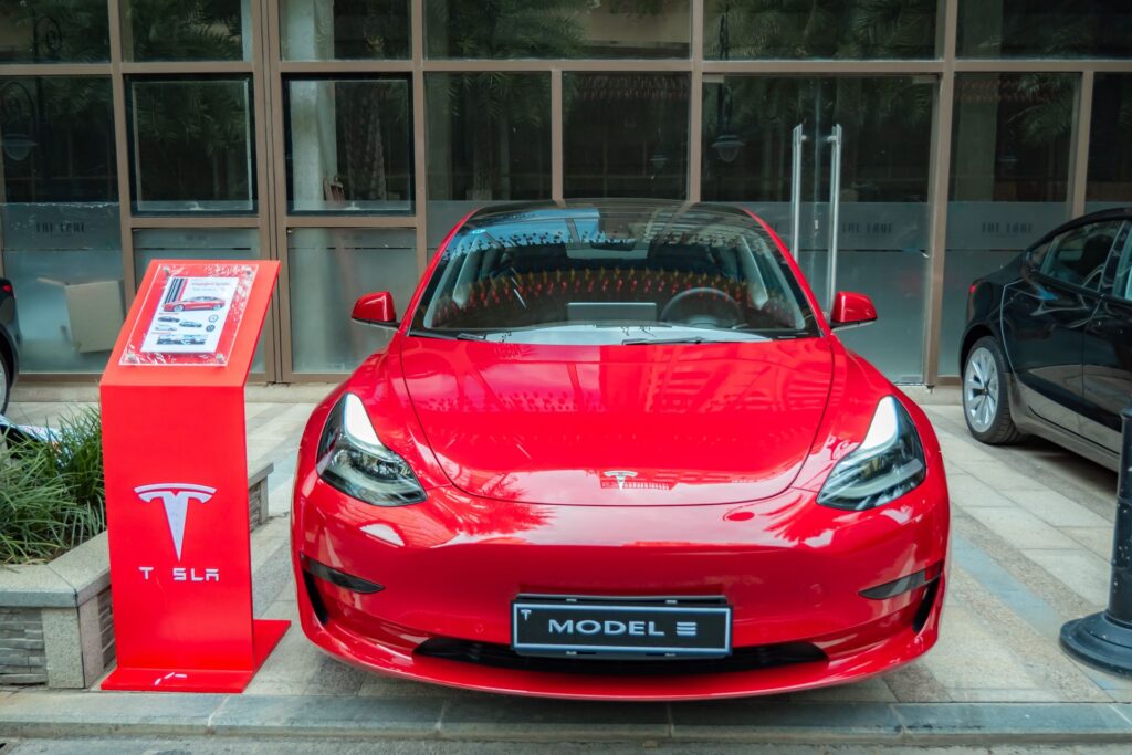 Tesla Model 3 in red in a showroom